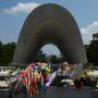 Flowers and chains of origami cranes are laid as a peace offering at Hiroshima Peace Park. Photo by JL, (c) ASC