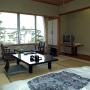 Interior of a traditional ryokan guestroom with futon and table. Photo by JL, (c) ASC