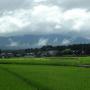 View of rice fields and houses in the distance. Photo by JL, (c) ASC