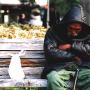 A homeless man rests on a park bench Tokyo. Photo (c) KV, all rights reserved