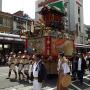 A team of men carry a portable mikoshi shrine during a festival Osaka. Photo by JL, (c) ASC