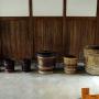 Large barrels rest on the doma dirt floor in a building at Takayama Jinya Gifu prefecture. Photo by JL, (c) ASC
